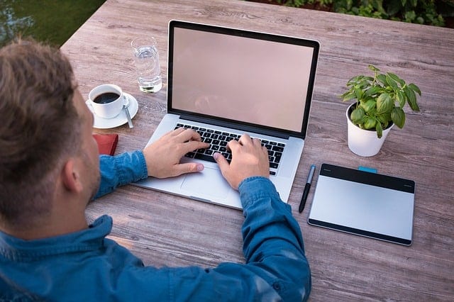 project manager sitting at desk