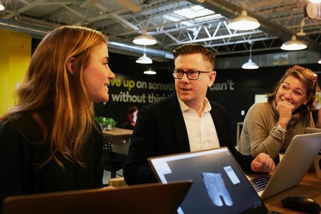 project leader discussing status with team member