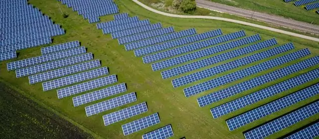 fields covered in solar panels - sustainability